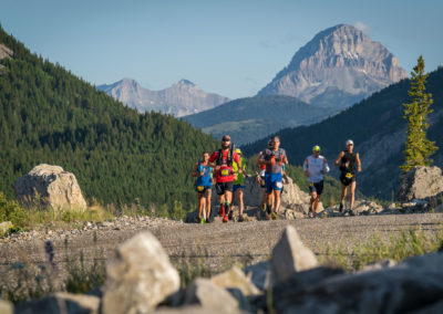 Group of Runners with Crowsnest Mountain in Background